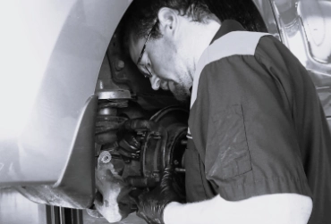 Mechanic doing a caliper repair